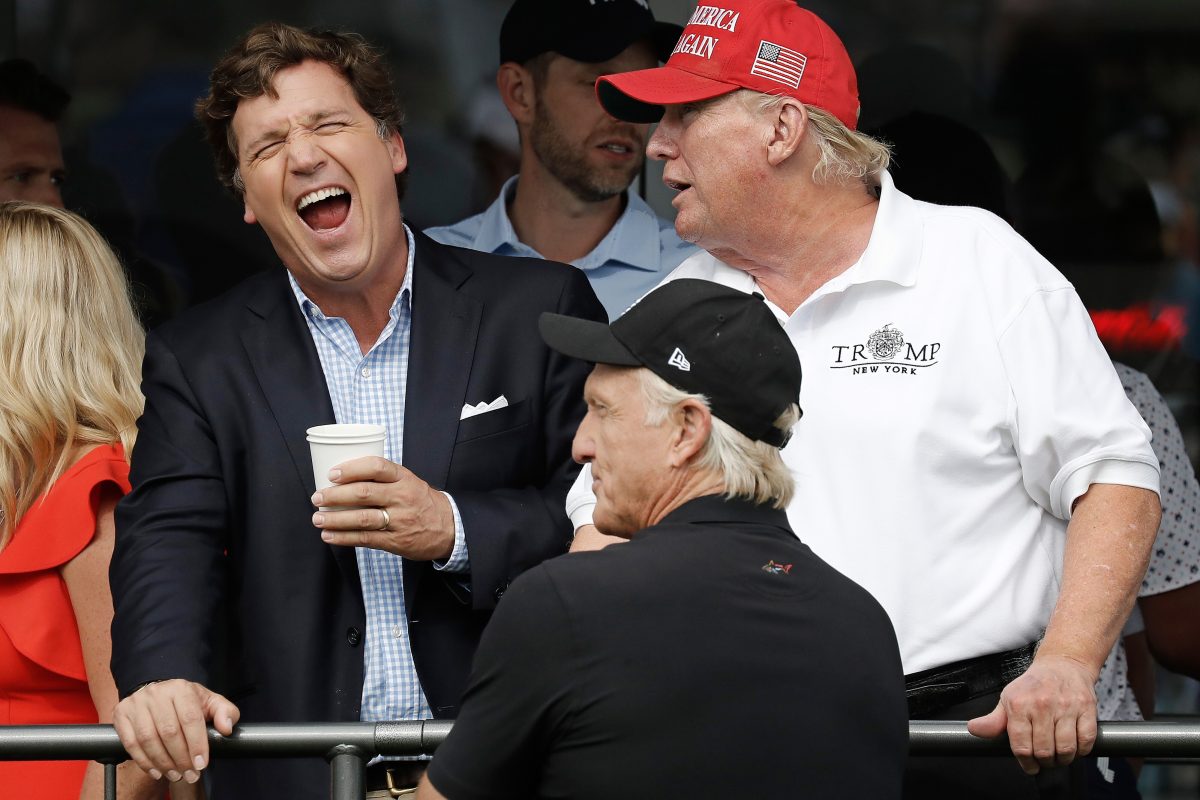 Fox TV host Tucker Carlson, left, laughs as he speaks with Former President Donald J. Trump at LIV Golf Bedminster invitational, part of the new LIV Golf Invitational Series, at the Trump National Golf Club on Sunday, July, 31 2022 in Bedminster, New Jersey.. Photo by Peter Foley/UPI Photo via Newscom picture alliance