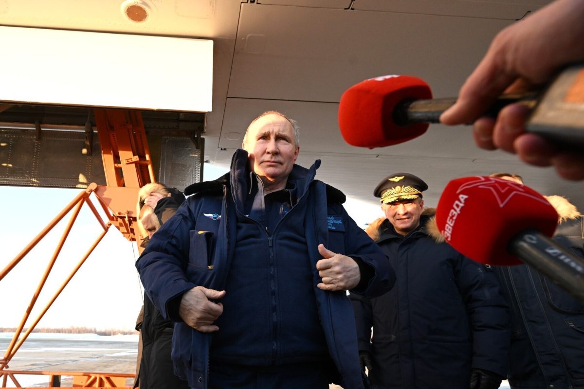 KAZAN, RUSSIA - FEBRUARY 22: (----EDITORIAL USE ONLY - MANDATORY CREDIT - 'KREMLIN PRESS OFFICE / HANDOUT' - NO MARKETING NO ADVERTISING CAMPAIGNS - DISTRIBUTED AS A SERVICE TO CLIENTS----) Russian President Vladimir Putin answers the questions of the press members at the runway of the Kazan Aircraft Production Association after flying a modernized Tu-160M strategic missile carrier in Kazan, Russia on February 22, 2024. Kremlin / Anadolu