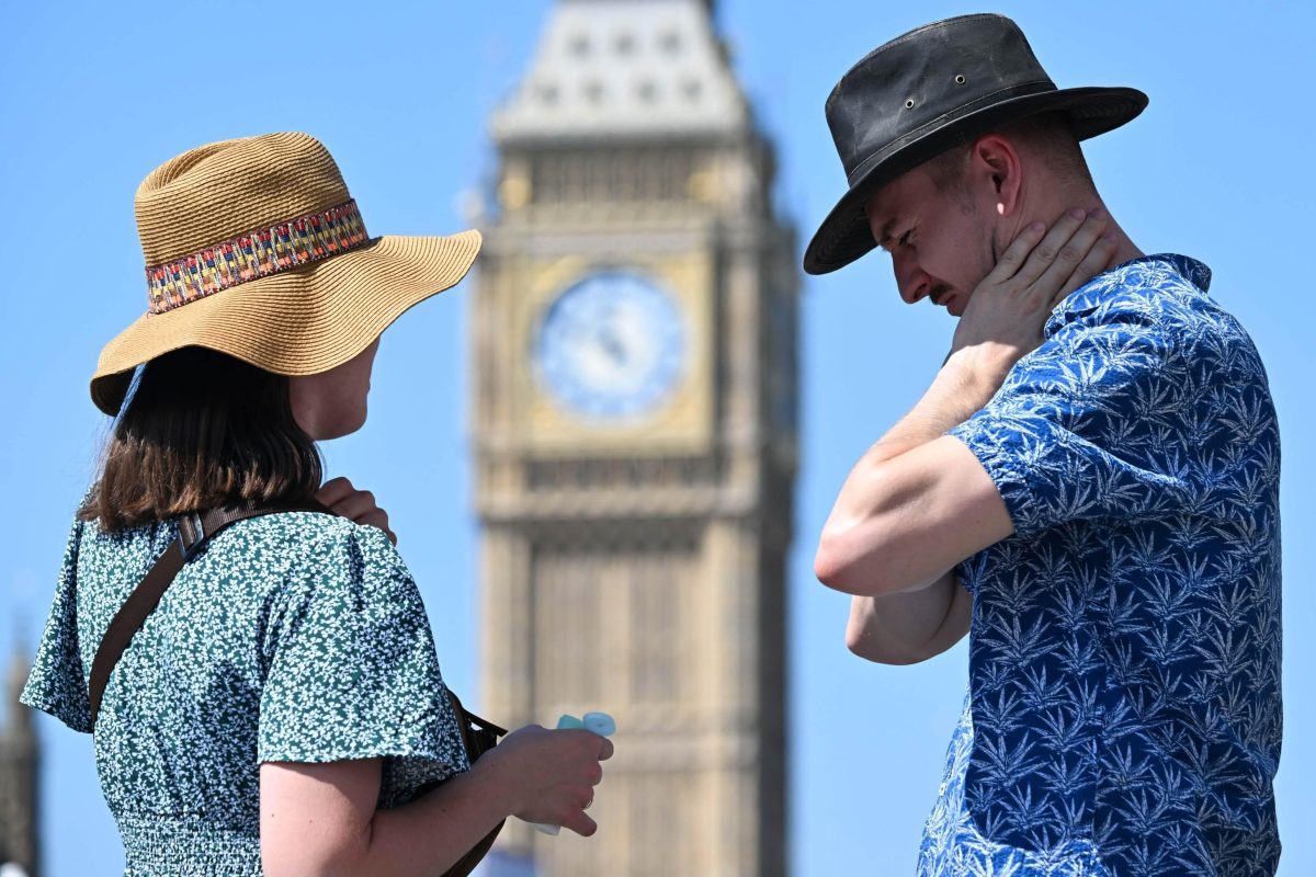LONDON, UNITED KINGDOM - JULY 30: People walking around the city use hats to protect themselves from the sun as the United Kingdom Health Safety Agency (UKHSA) issued a yellow alert for all areas of England due to increasing temperatures in London, United Kingdom on July 30, 2024. The UK Meteorological Office (Met Office) reported that temperatures could reach above 30 degrees. Rasid Necati Aslim / Anadolu